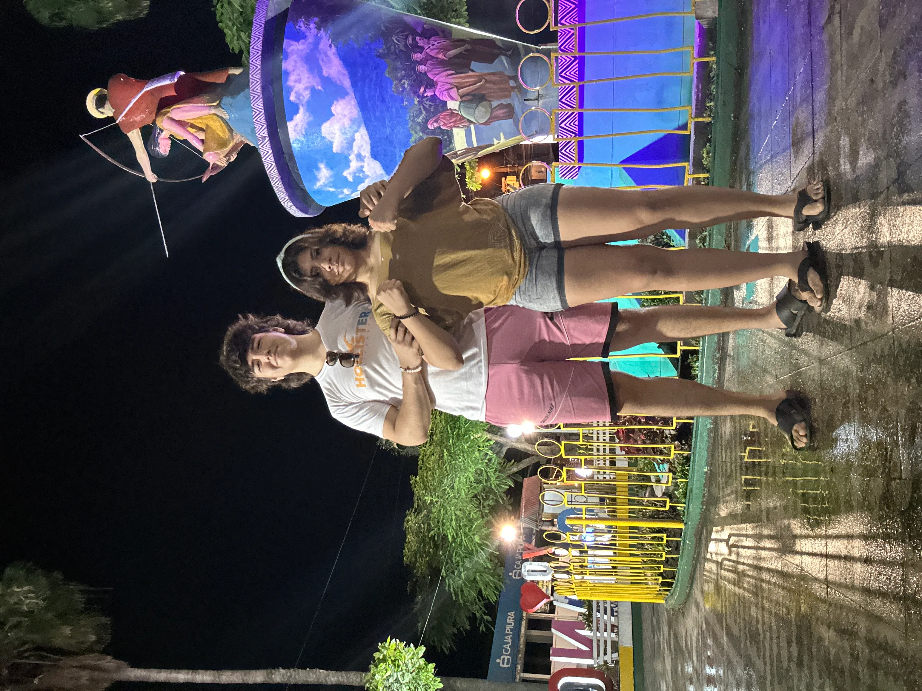 Ketlin and Barclay Leach posing together at an outdoor fair at night